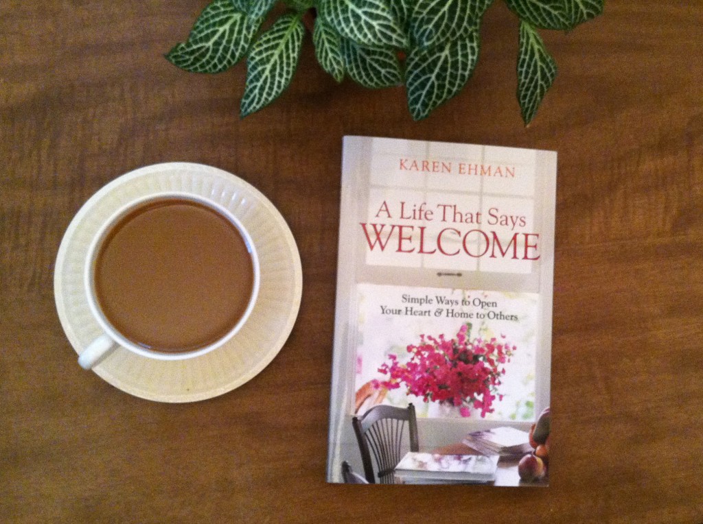 A Life That Says Welcome book next to a tea cup