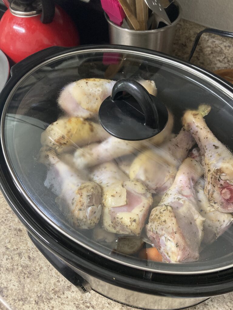 chicken drumsticks and potatoes in a crock-pot