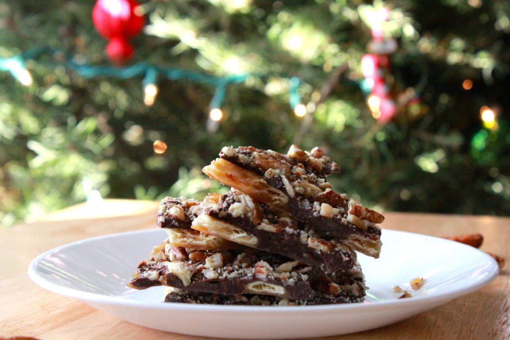 Picture of yummy Christmas treats in front of Christmas tree