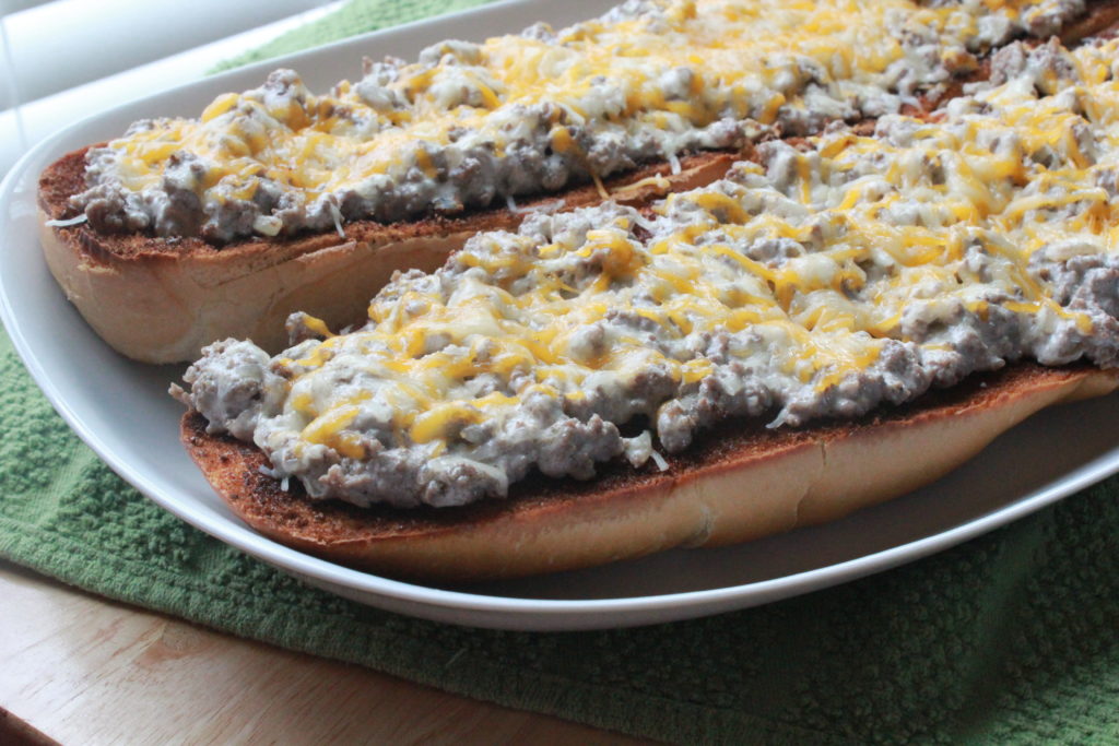 open-faced beef stroganoff sandwiches on platter